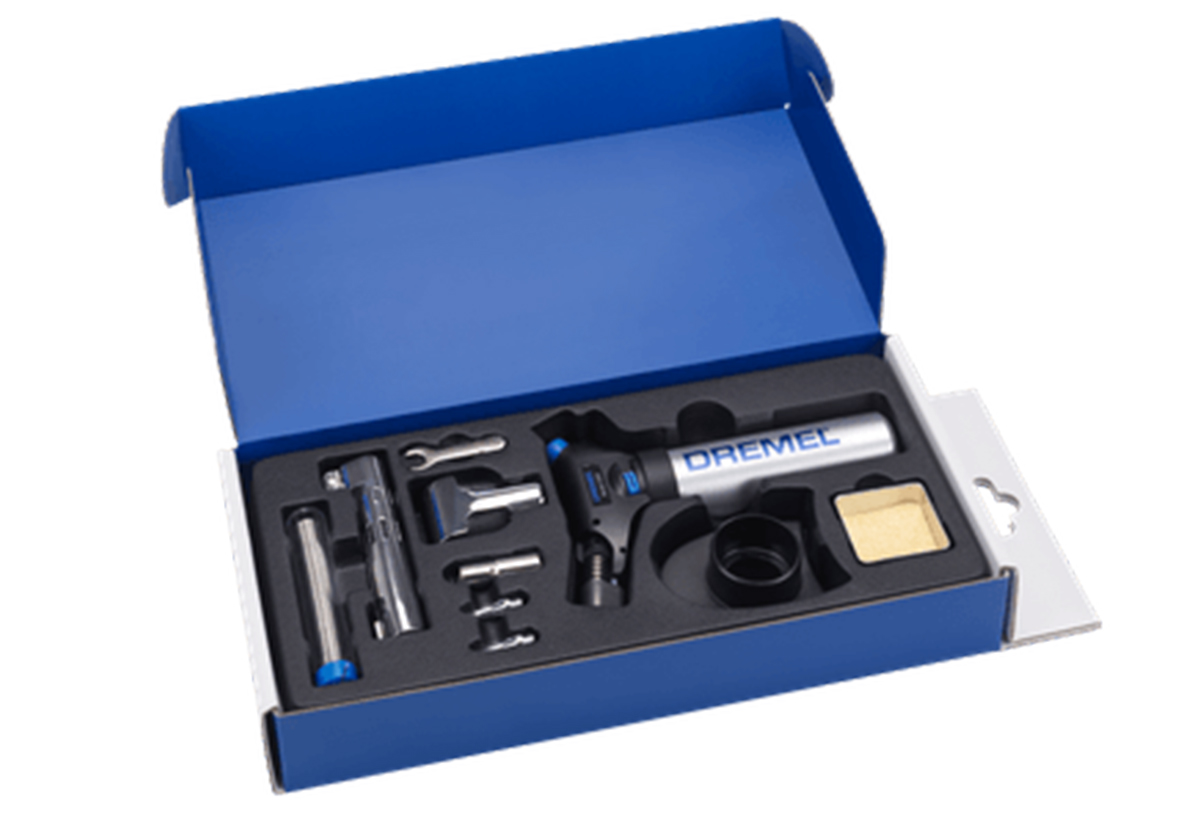 Απεικονίζεται το καμινέτο και τα εξαρτήματά του στη θήκη.